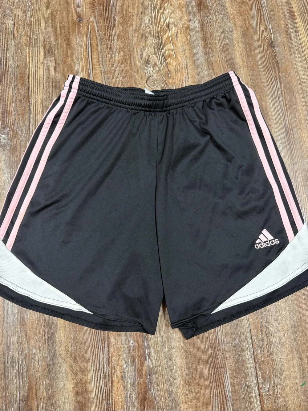 Adidas black shorts with baby pink and white stripes on sides, size S